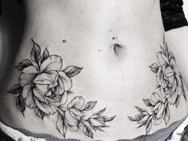 Tatuagem de rosas na barriga feminina Tatuagem de rosas na barriga feminina