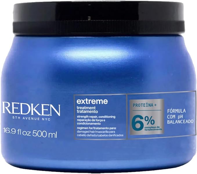 Cabelos Porosos. Máscara de tratamento redken, embalagem azul e tampa preta.